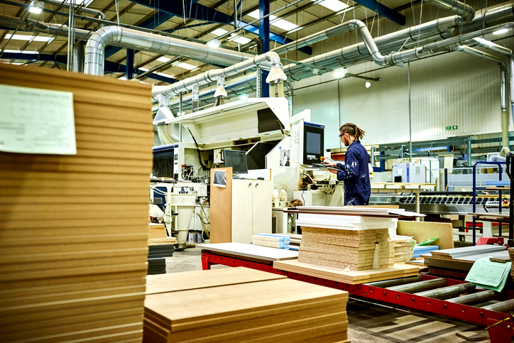 Cozy living room with a neutral color palette, wooden coffee table, and contemporary furniture in a bright space.