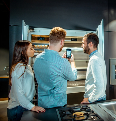 A couple choosing a refrigerator