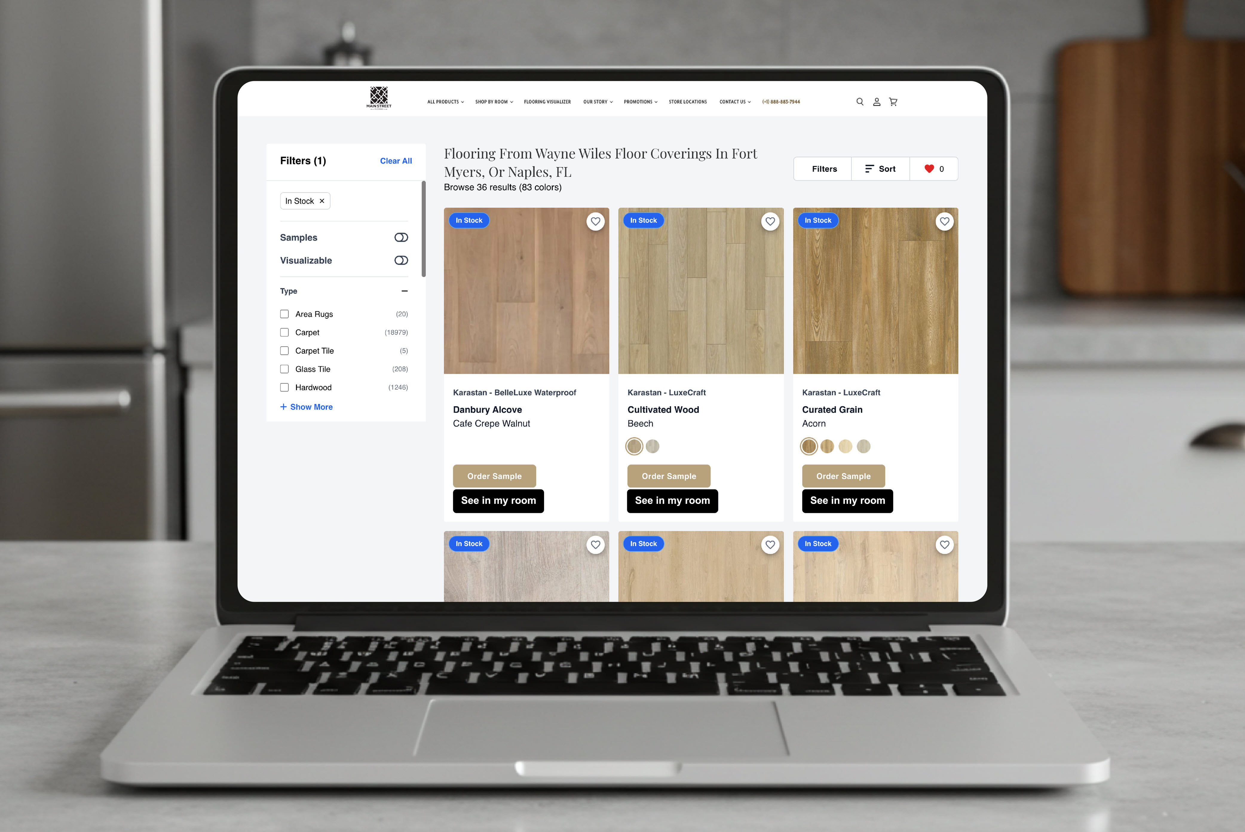 Laptop screen displaying an online flooring catalog with product images, filter options, and buttons to order samples or preview floors in a virtual room.