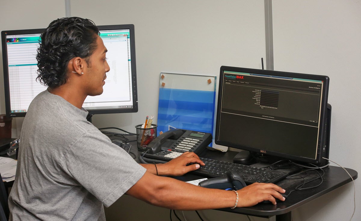 Glas Pro employee working at the computer