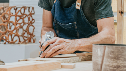 The man is engaged in a woodworking